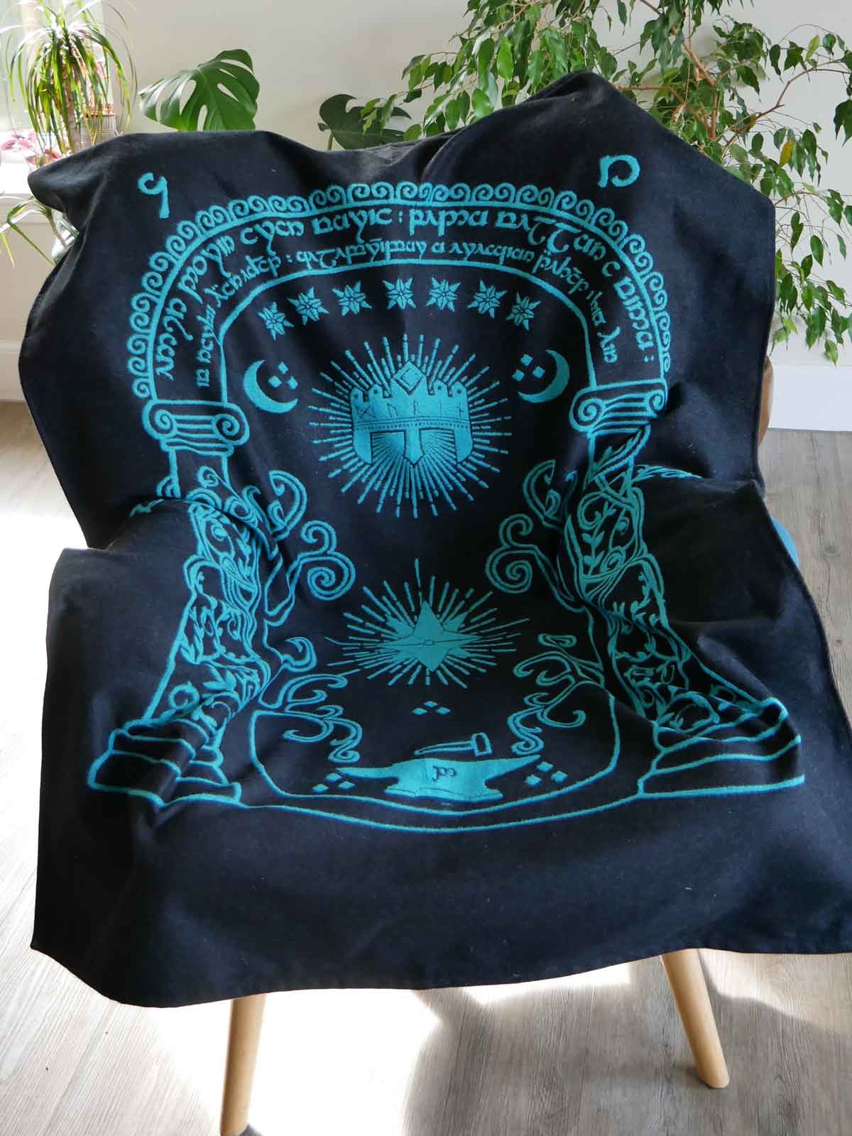 doors of durin design on a blanket in black and blue