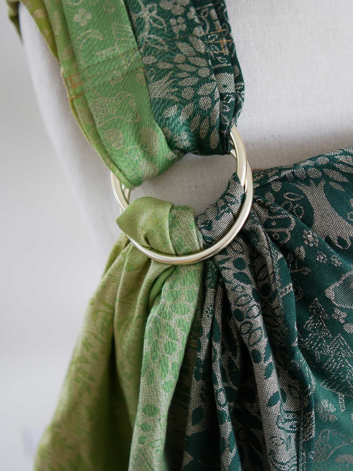 Close up of a ring with animal folk design on a mannequin