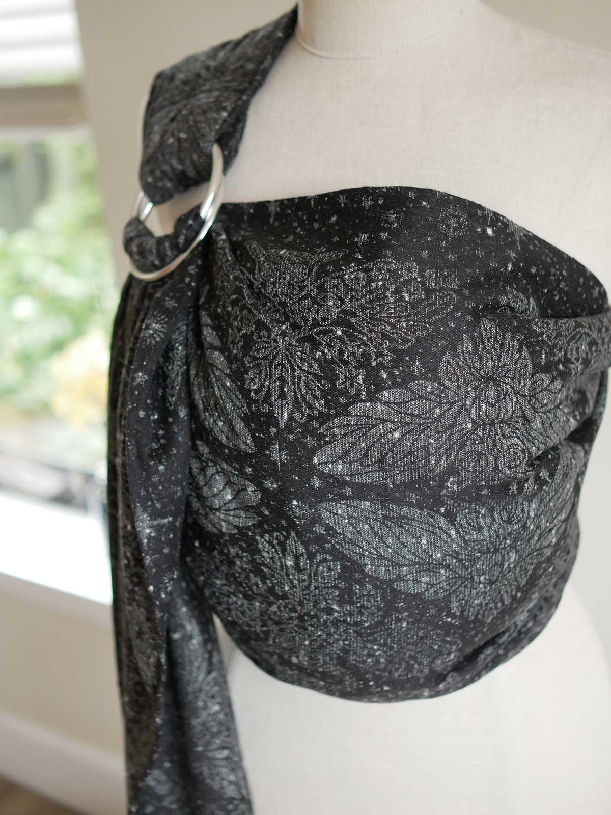 Black ring sling with sliver owls and stars, on a mannequin.
