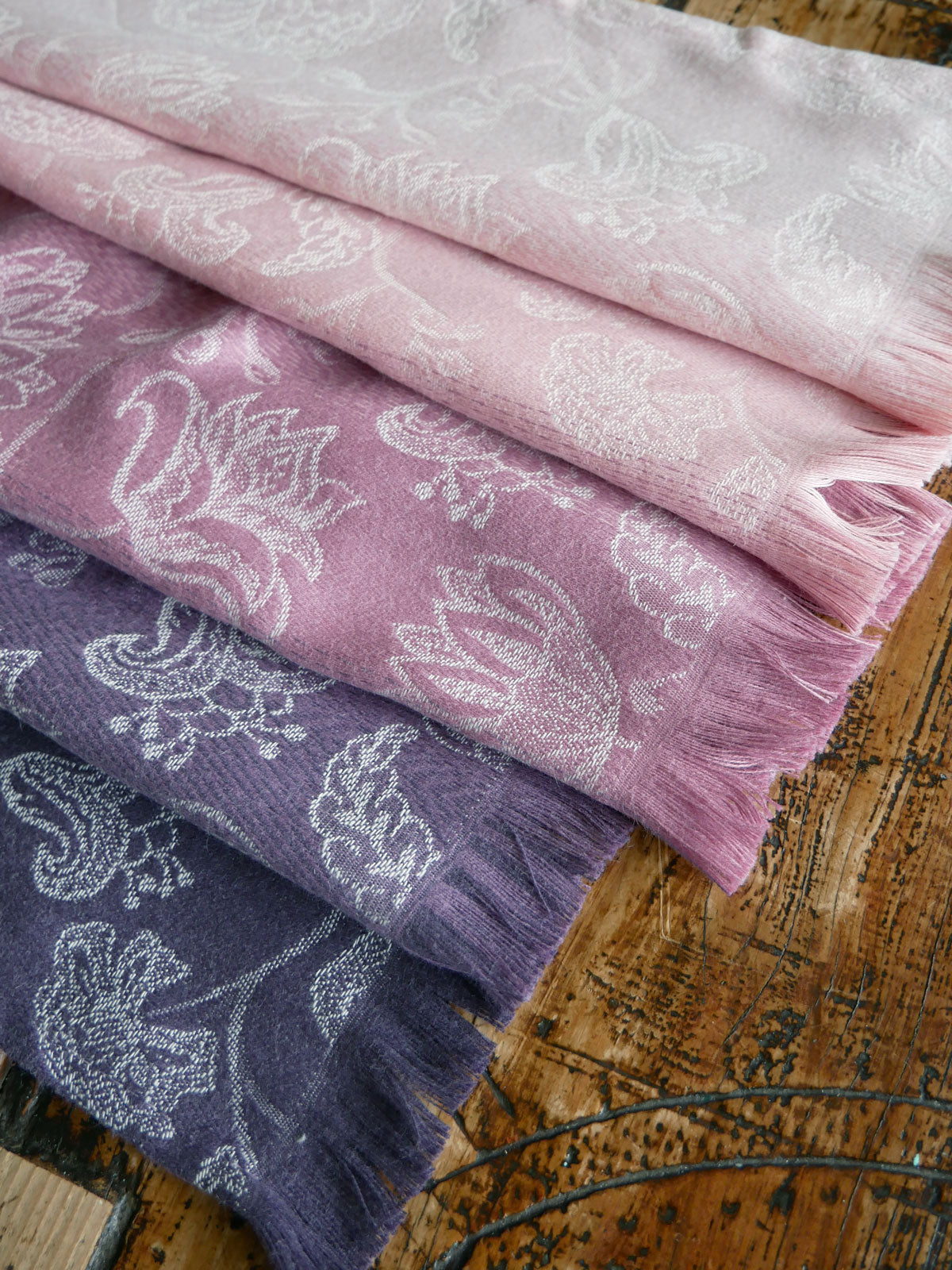 Close up of pink and purple fabric with fringing