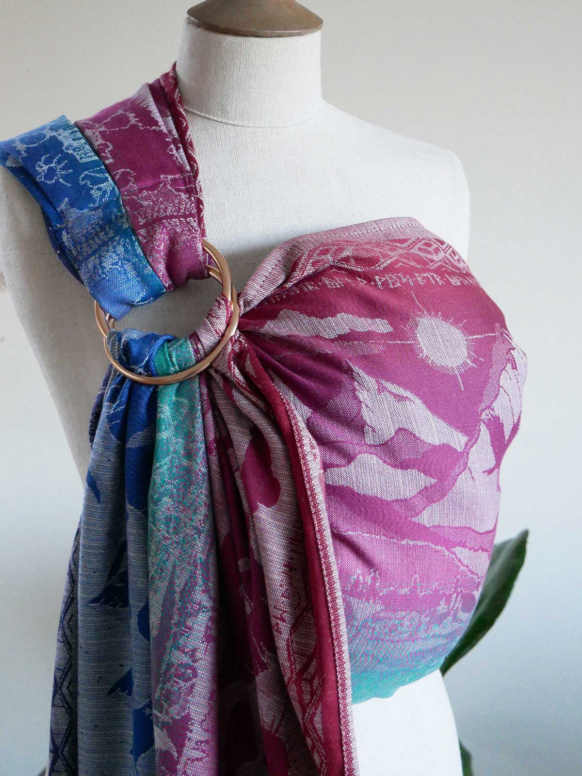 Colourful ring sling on a mannequin with a white background
