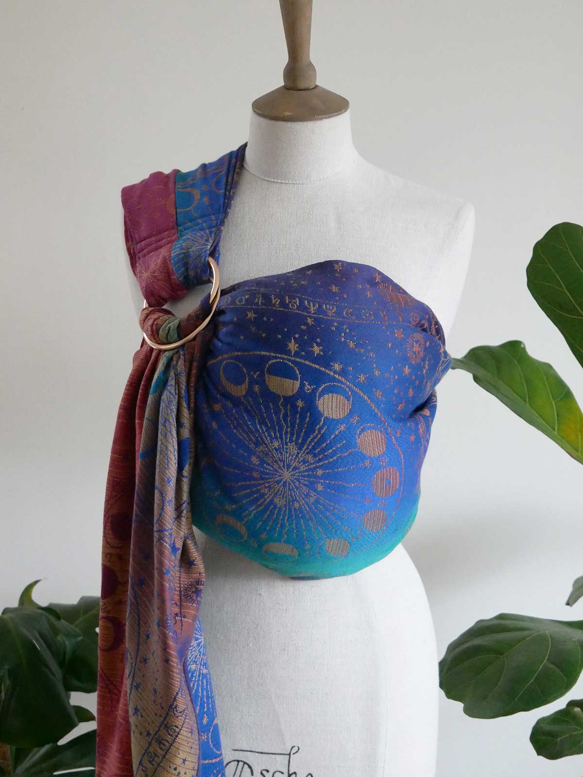 Lunae Aurelia Ring Sling in jewel colours with star pattern on a mannequin against a white background