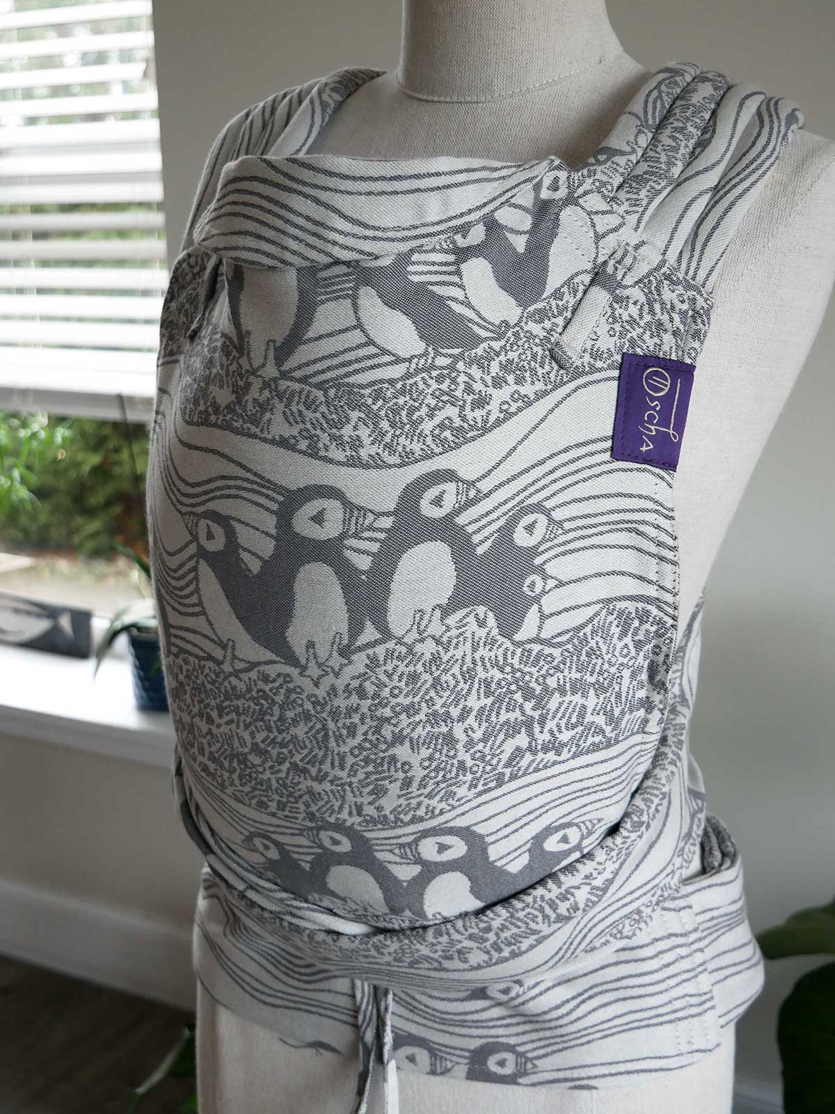 Puffins Muckle Flugga Cairis Baby Carrier on a mannequin against a neutral background