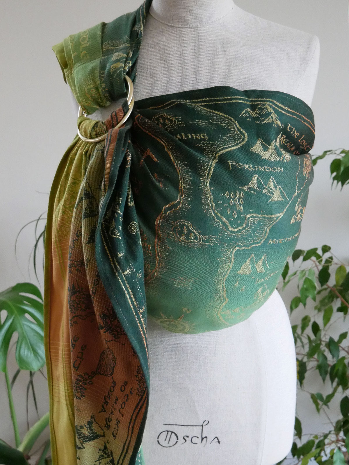 A green ring sling with map design.