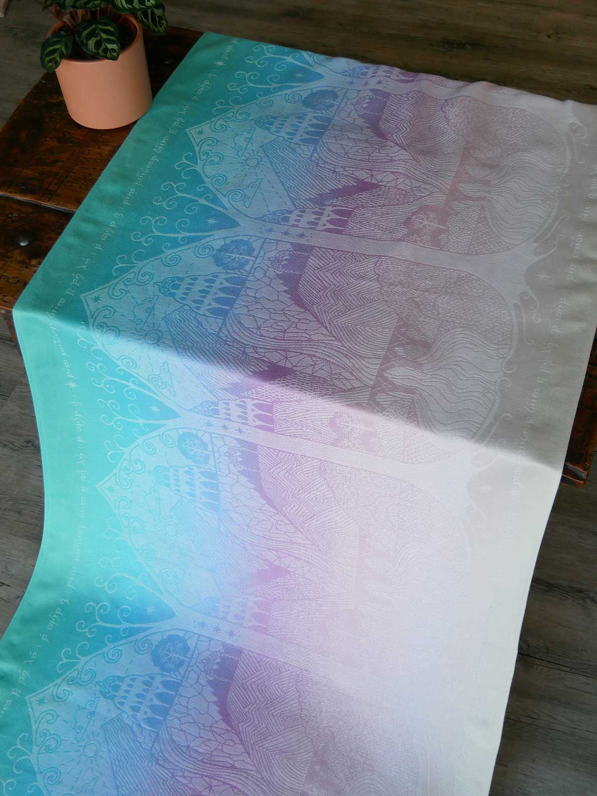 Colourful fabric with abstract patterns on a wooden surface