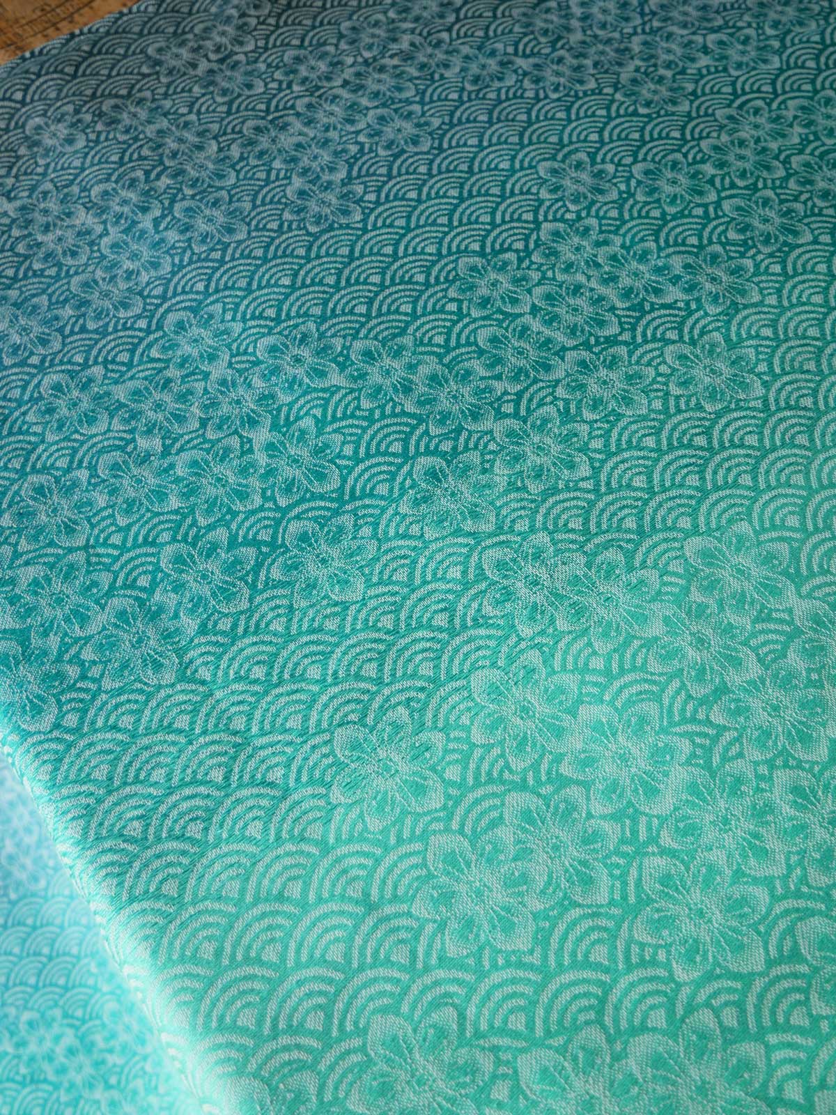 Teal fabric with a subtle pattern