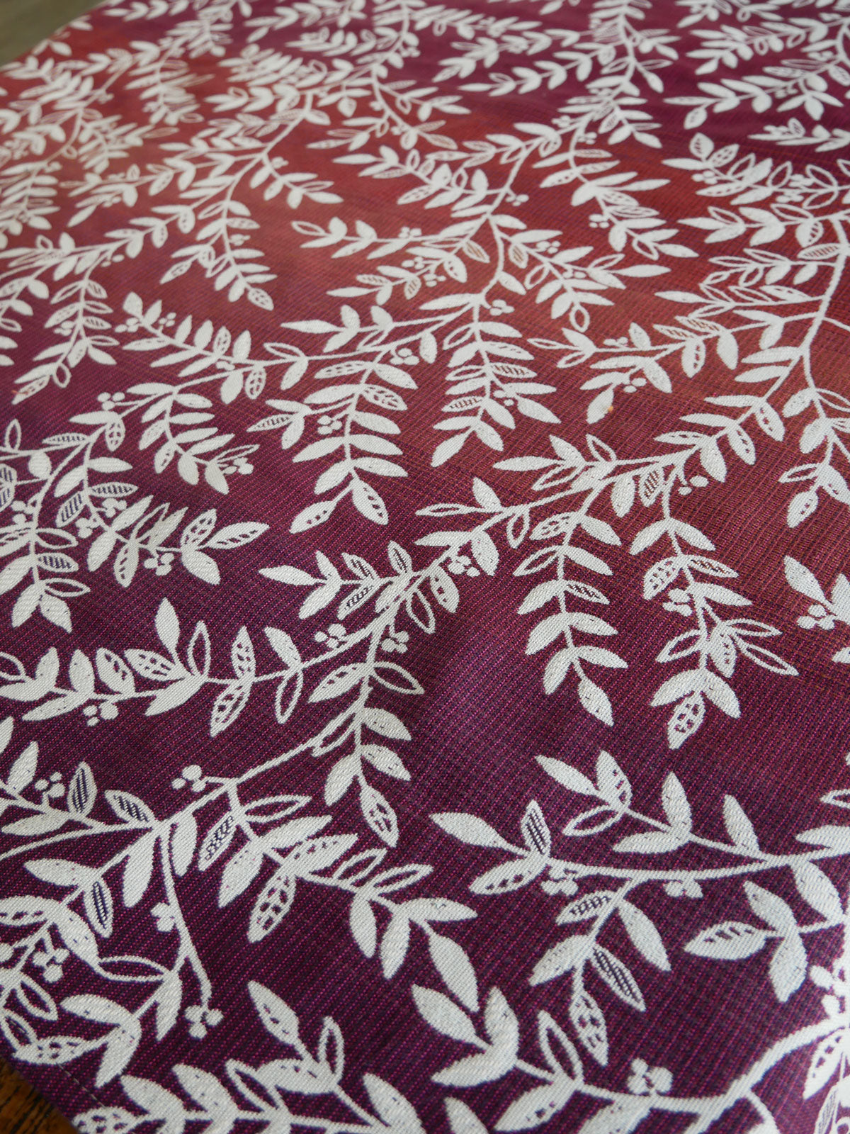 Burgundy purple fabric with white leaf pattern