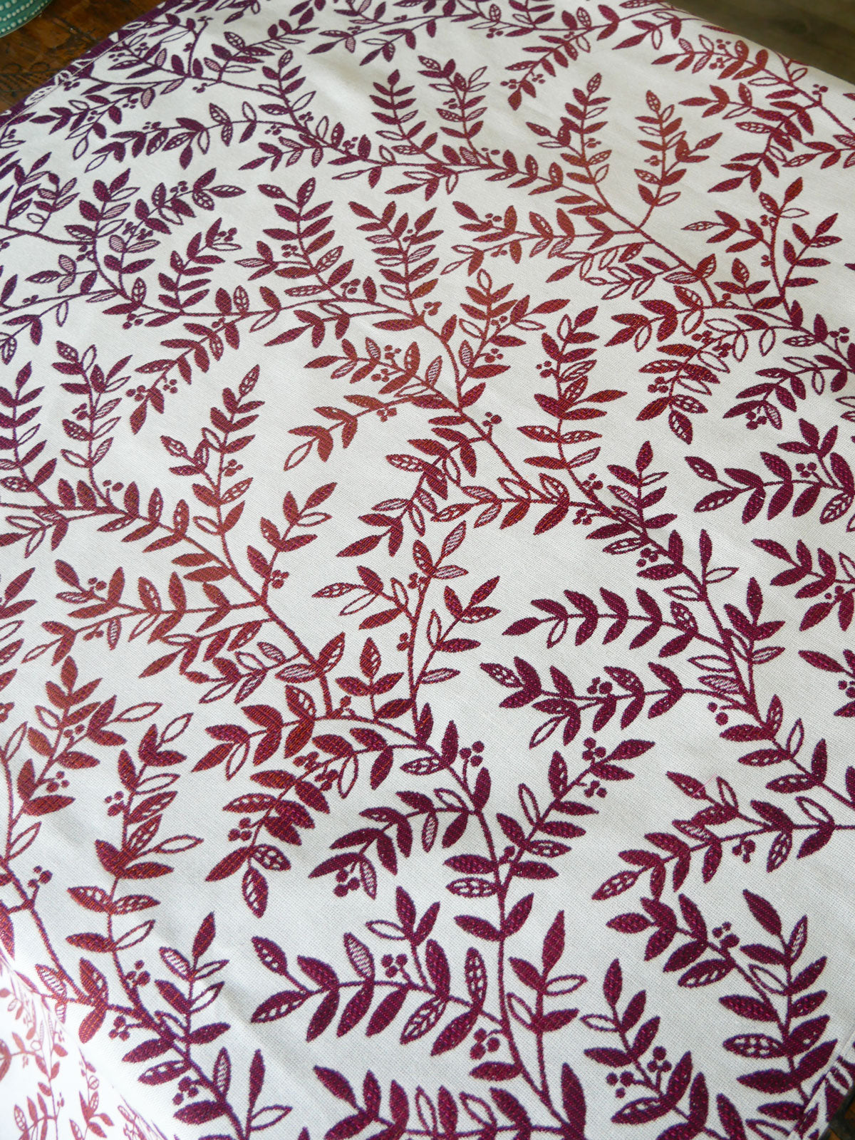 Fabric with Burgundy purple leaf pattern on a white background