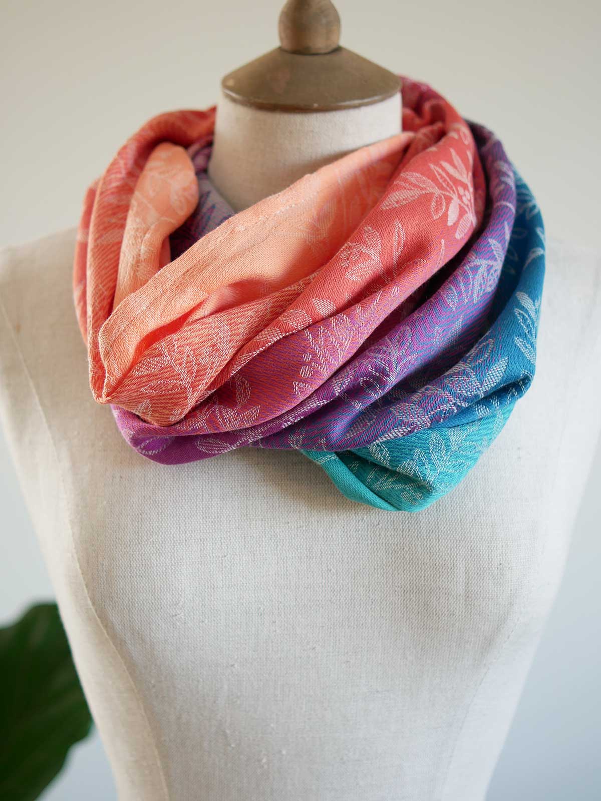 Colorful scarf on a mannequin with a white background