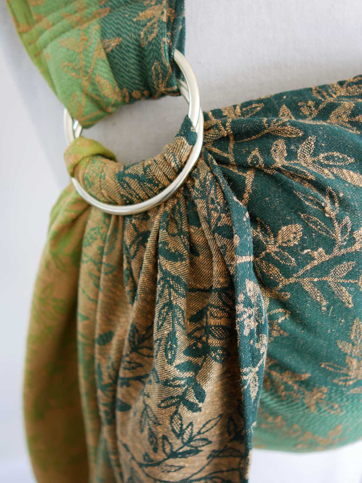 Close up of rings on a green ring sling