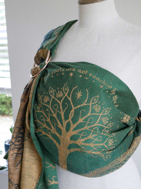 Green ring sling with gold tree design on a mannequin
