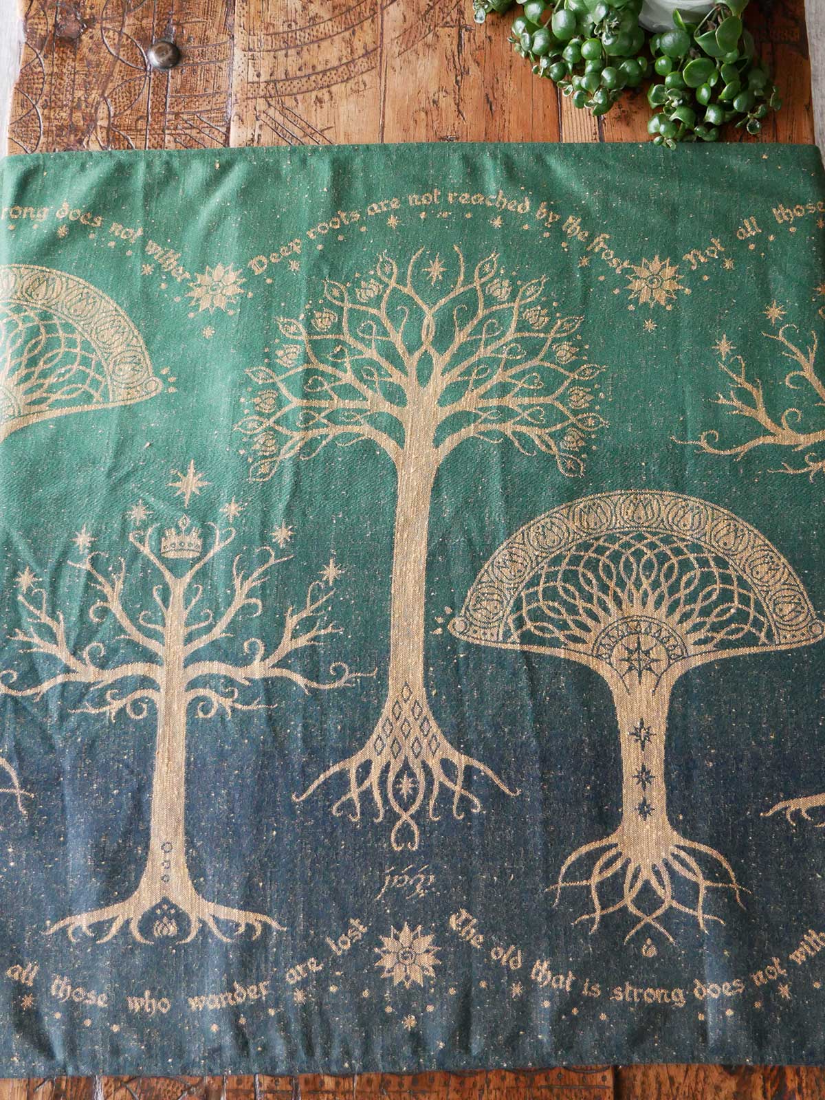 Decorative fabric with tree designs on a wooden surface