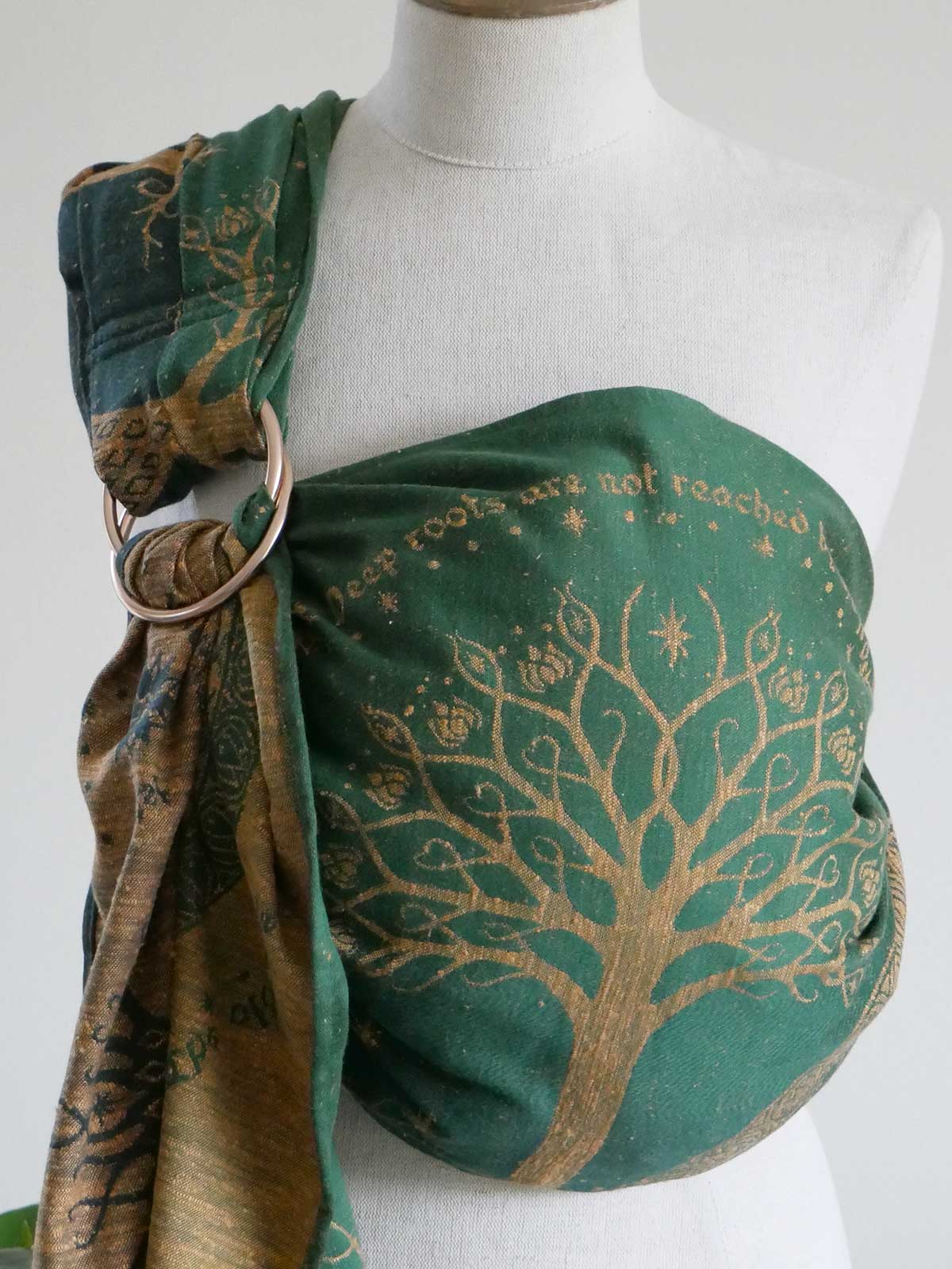 Green ring sling with tree design on a mannequin