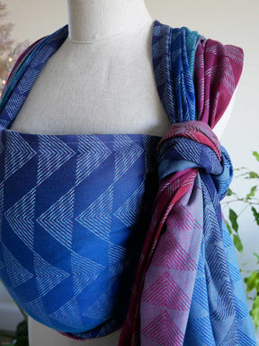 Mannequin wearing a blue and garnet patterned scarf