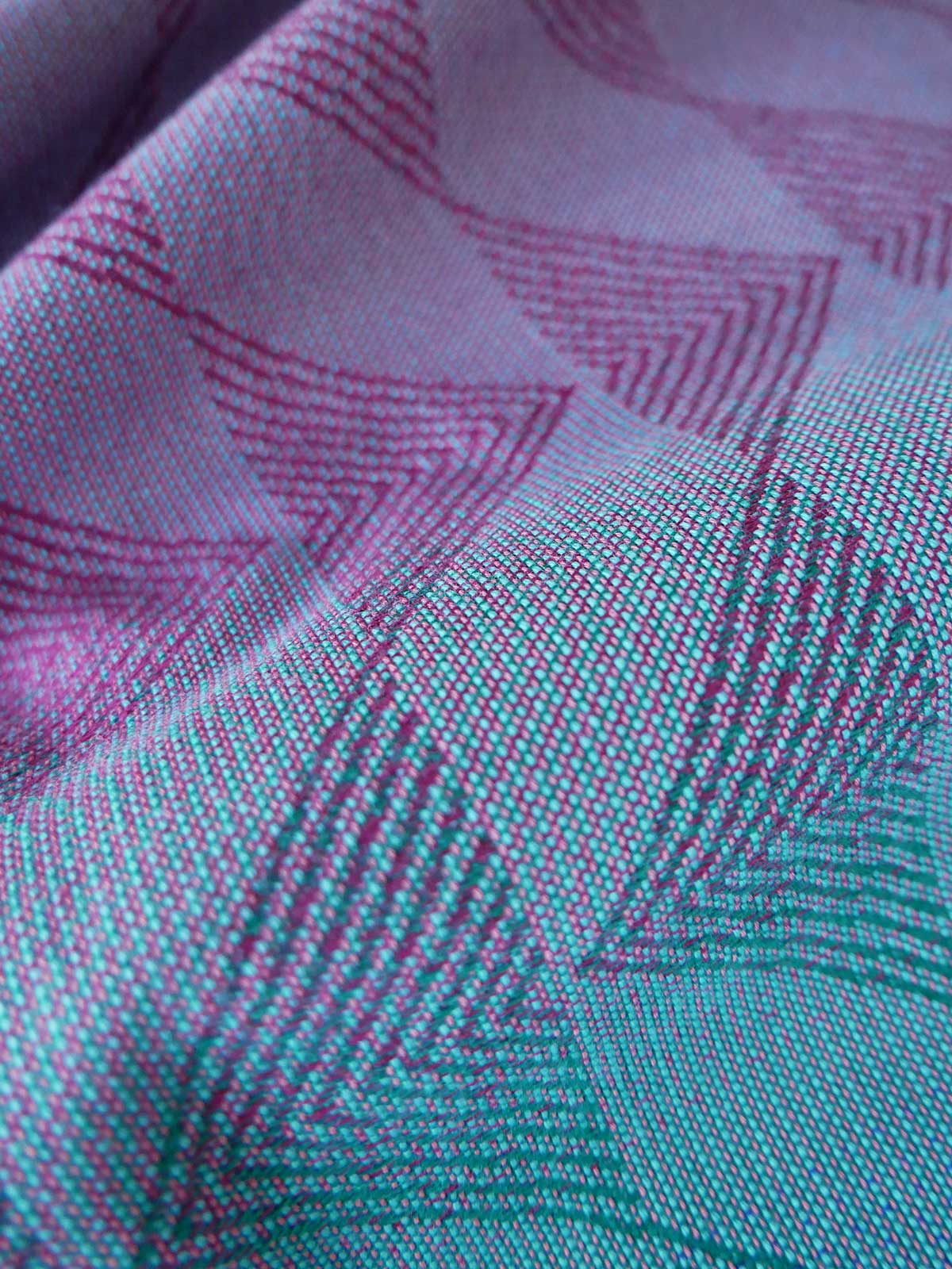 Close-up of the reverse of a fabric with pink and green pattern