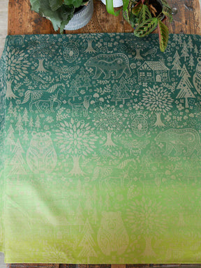 Green fabric with animal folk design.