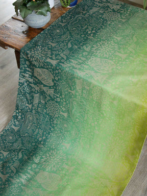 Green fabric with animal folk design.