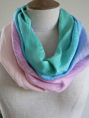 Pastel-colored cowl on a mannequin against a neutral background