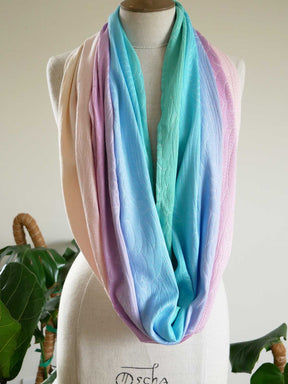 Pastel gradient loop scarf on a mannequin with a white background