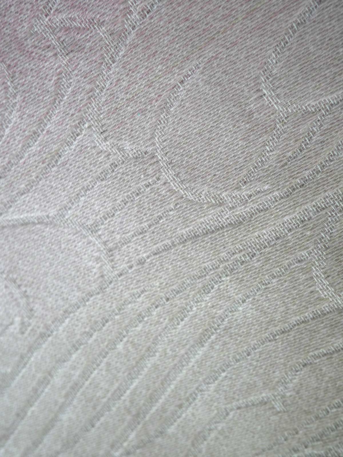 Close-up of textured gray fabric with a subtle pattern
