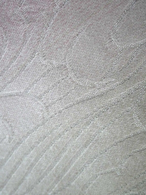 Close-up of textured gray fabric with a subtle pattern