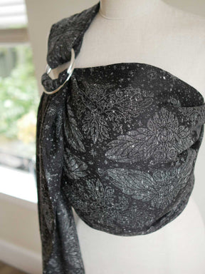 Black ring sling with sliver owls and stars, on a mannequin.
