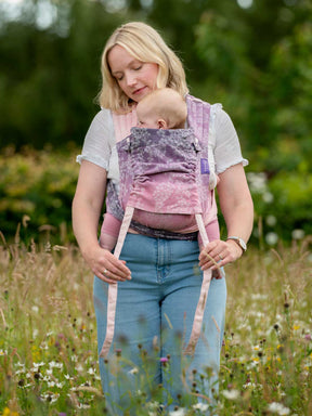 Cairis baby carrier with hood. 