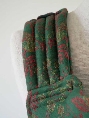 Green and red patterned fabric on a white background