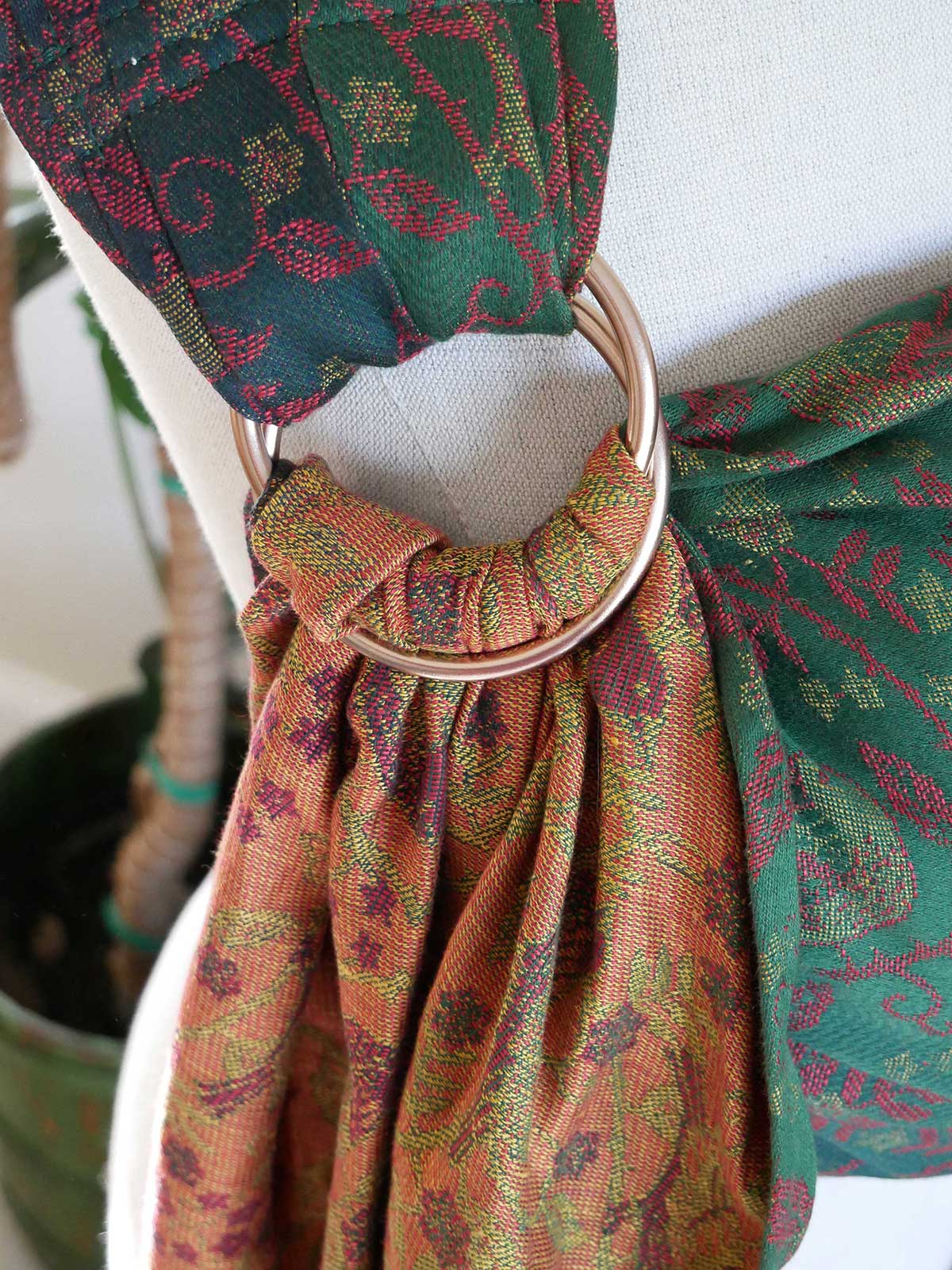 Close-up of a patterned fabric with a gold ring