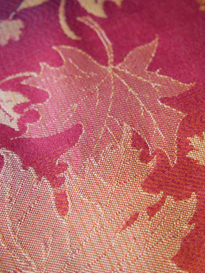 Close up of a pink fabric with leaf pattern