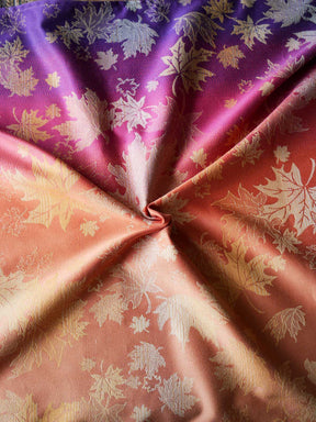Purple, pink and orange woven wrap with leaf patterns 