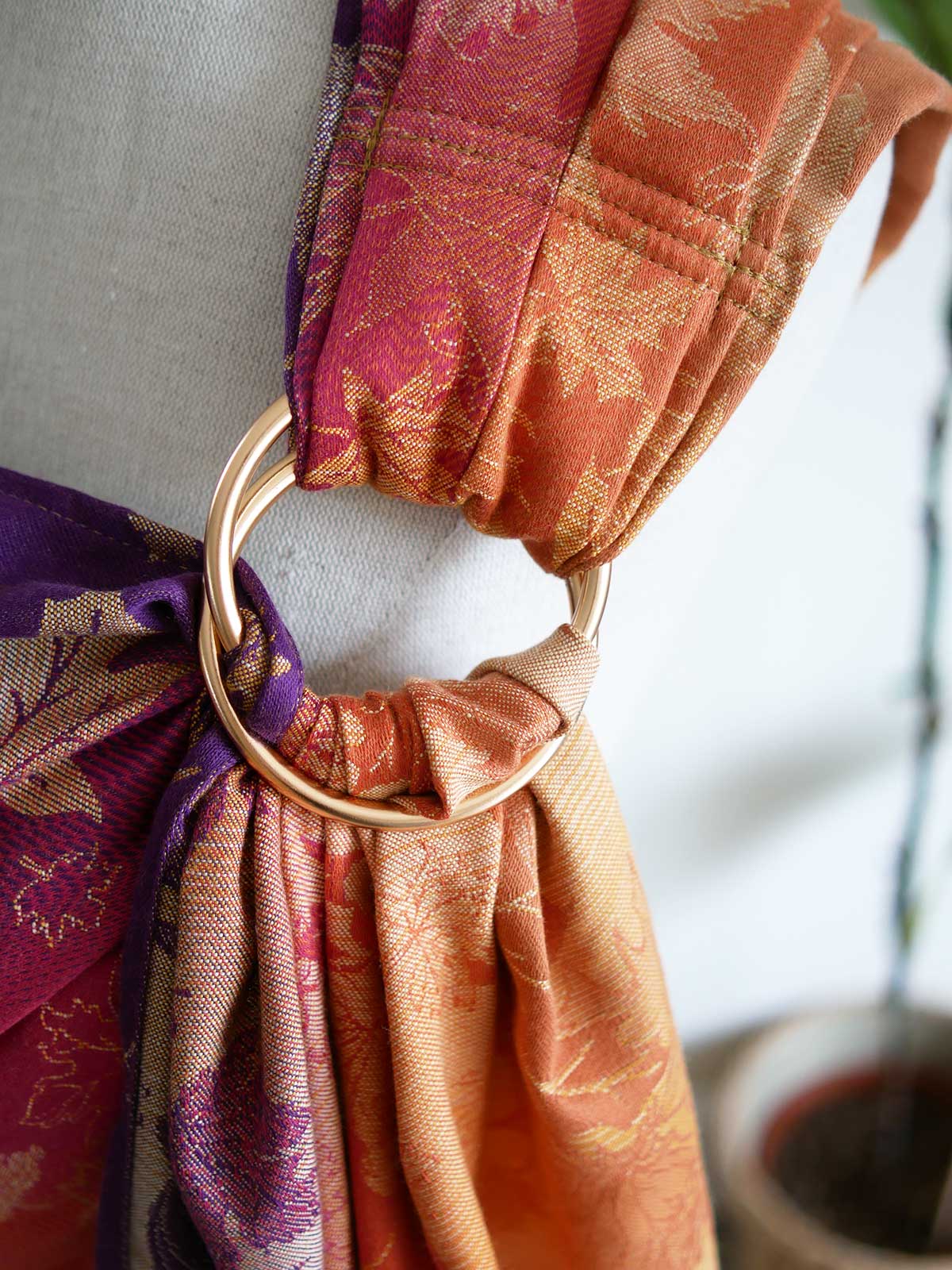 Close up of gold ring on a ring sling
