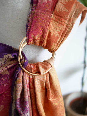 Close up of gold ring on a ring sling
