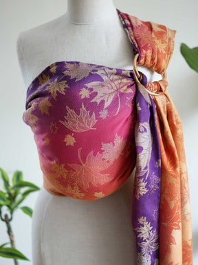 Autumnal coloured ring sling with leaf patterns on a manneuin