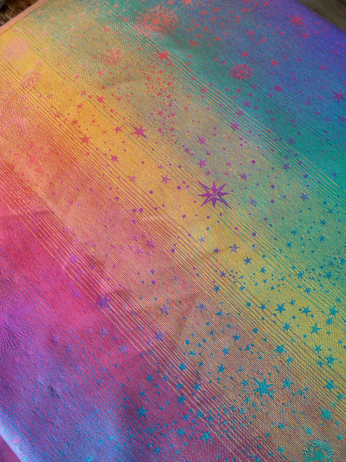 Colorful fabric with star pattern and gradient from pink to blue
