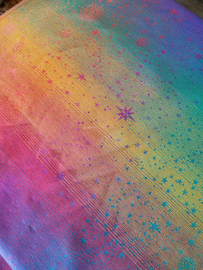 Colorful fabric with star pattern and gradient from pink to blue
