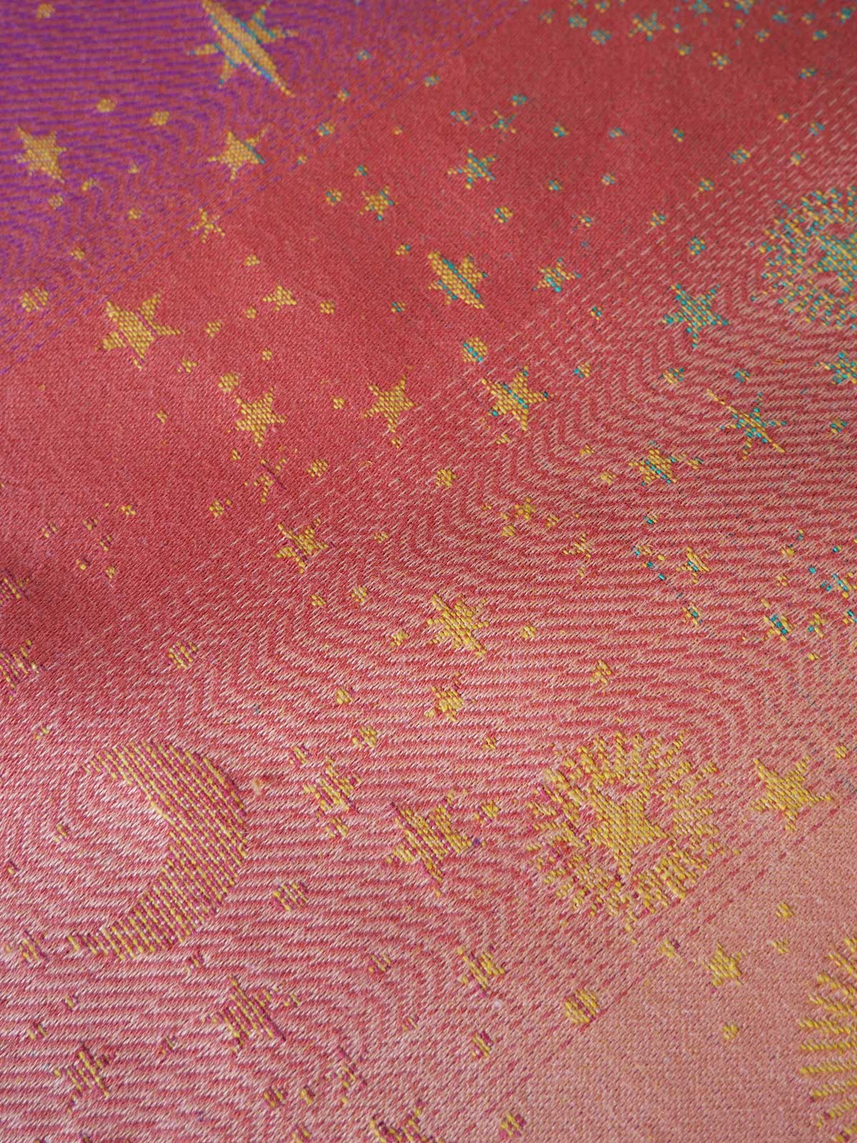 Textured fabric with star patterns on a red background