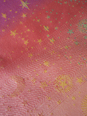 Textured fabric with star patterns on a red background