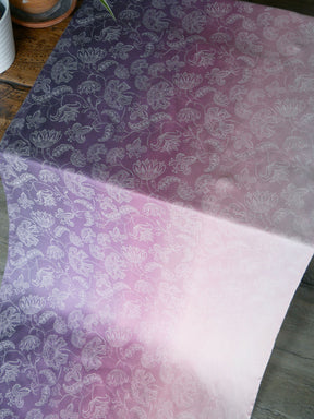 Pink and purple fabric with flower design