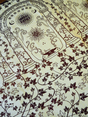 Decorative design with intricate patterns and symbols on a beige background