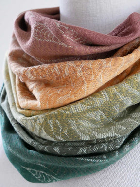 Patterned scarf in various colors on a white background