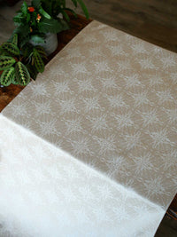 Fabric with intricate pattern on a wooden chest
