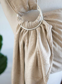 Ring sling on a mannequin with a neutral background