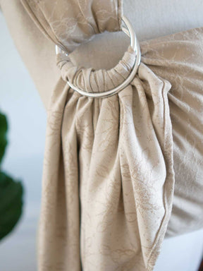 Ring sling on a mannequin with a neutral background