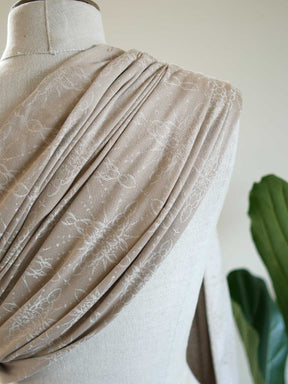 Ring sling on a mannequin with a neutral background