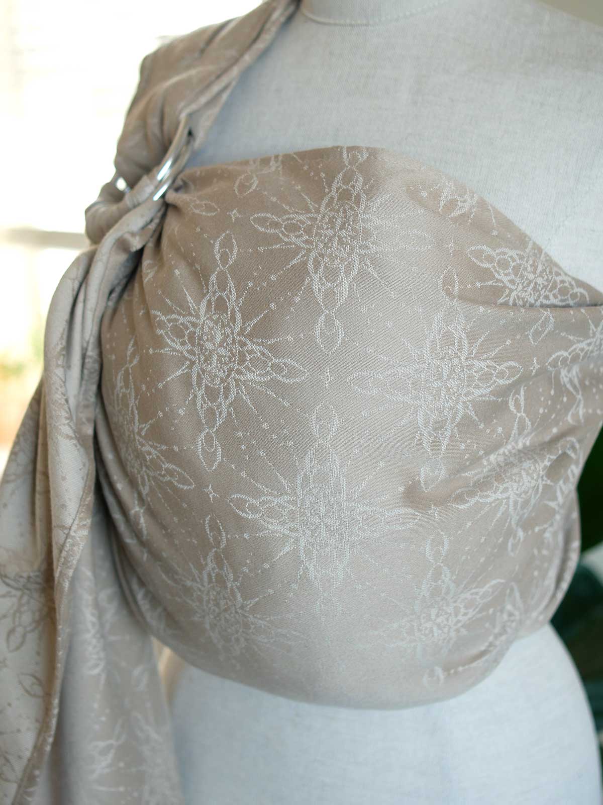 Ring sling on a mannequin with a neutral background