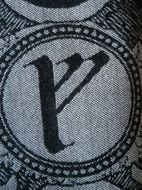 Close-up of a black 'motif on a textured background