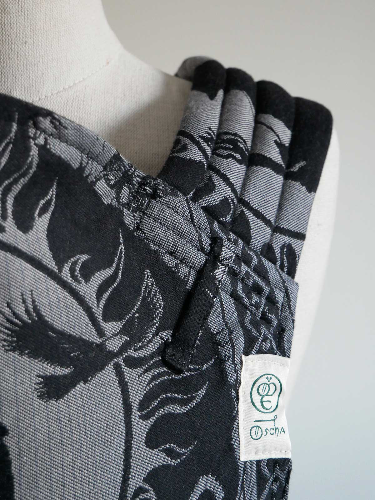 Black and gray patterned fabric on a mannequin with a visible brand label.