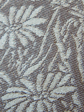 Close-up of a textured fabric with leaf pattern
