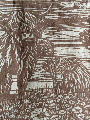 Close up of fabric with highland cows